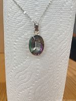 Front view of necklace on display highlighting pendant and chain