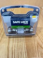 Front view of packaged Weiser Safe Lock hall & closet passage knobset