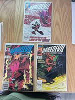 Group shot of three Daredevil issues #278, #279, #280 in bags