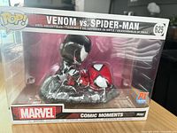 Front view of boxed Funko Pop! Venom vs Spider-Man figure showing window and PX sticker