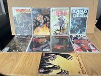 Group shot of all nine bagged comics on tabletop