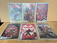 Six bagged comics laid out showing all covers