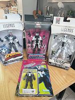 Group shot showing all four sealed action figures