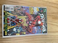 Amazing Spider-Man issue with Carnage on cover in bag and board