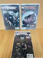 Front view of all three bagged Venom comics issues 7, 8, 9