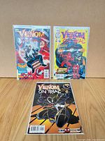 Three bagged Venom: On Trial comics displayed