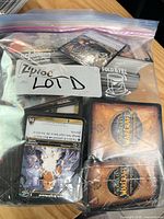 Ziploc bag labeled Lot D containing stack of World of Warcraft TCG cards