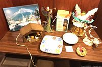 Overall lot showing nativity, angels, LED lights box, plates, bowl, wreath, canvas