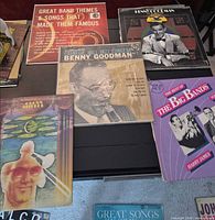 Tabletop view of five LP covers showing all included records