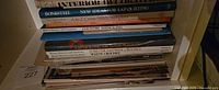 Stack of hardcover craft books on shelf