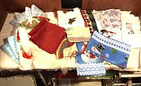 Overview of assorted linens and throws spread on surface