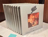Side view of all ten Giants of Jazz box sets standing upright