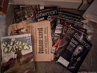 Stack of shooting and hunting magazines including Rifleman, Sporting Classics and others