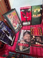 Front view showing six VHS tapes including Death Wish, House of Usher, Crimson Tide demo, Batman, Citizen X, and Touch of Evil