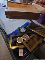 Box labeled Ventyun with registers and round vents visible