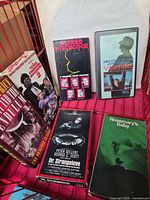 Front view of six VHS tapes inside basket