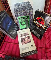Front view of all four VHS items including box set and three individual tapes