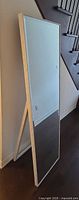 Side view of mirror showing full height and easel support