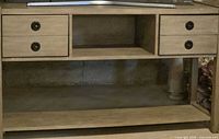Front view showing two drawers, open shelf and overall structure
