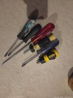 Five assorted screwdrivers displayed side by side