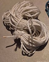 Coiled white twisted polypropylene rope