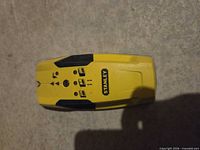 Yellow Stanley stud finder top view