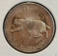 Reverse of 1967 Canada centennial quarter showing bobcat and dual date