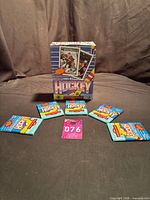 Five sealed wax packs arranged with display box shown behind (box not included)