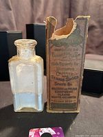 Box and bottle side by side showing overall form and relative size