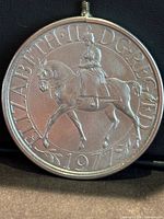 Obverse showing Queen Elizabeth II on horseback, year 1977, bail visible