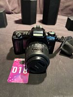 Front view of Pentax MZ-10 camera with 35-80mm lens and strap