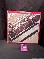 Front cover showing band looking over stairwell railing