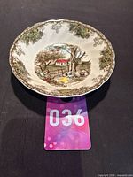 Top view of Johnson Brothers Friendly Village bowl showing scene and rim