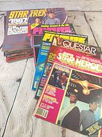 Stacked magazines and calendar angled view