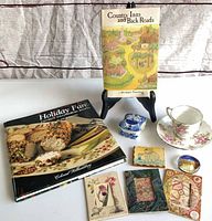 Group shot of books, teacup set, trinket box, magnets, frames