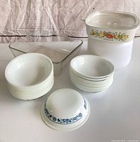 Group shot showing casserole with lid, square baker, stack of bowls and separate bowls