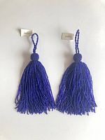 Front view of both tassels showing color, size, fringe detail