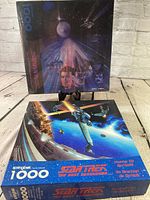 Both sealed puzzle boxes front view