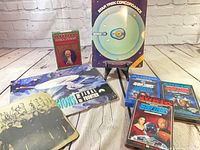 Group shot of all books, cassette sets and signed item