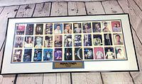 Full view of framed uncut trading card sheet with plaque
