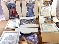 Plates in styrofoam boxes with COAs visible for Uhura, Mr. Spock, Dr. McCoy, Sulu, Chekov, Captain Kirk