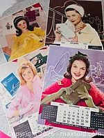 Four overlapping Victor Keppler Timken calendar posters