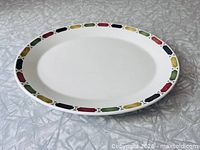 Full view of oval platter showing entire border pattern and white center