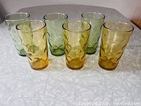 Front view six Hazel Atlas Eldorado glasses, three amber three green