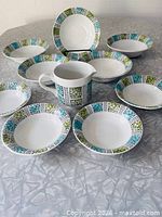 Full ten-piece Corinth set on table