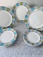 Stacked and standing plates showing pattern and quantity