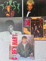 Group photo of all five album covers
