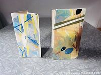 Front view of both vases showing abstract decoration and forms