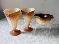 Two waffle cone glasses and brown bowl displayed
