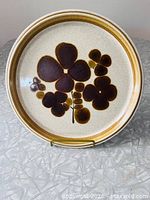 Front view showing full floral design and rim band